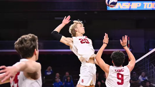 USC men's volleyball middle blocker Markus Olson jumps up to hit a quick set from Caleb Blanchette during a match at Galen Center.