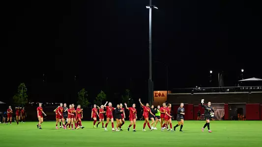 The USC women's soccer team waves to fans after the game against Portland.