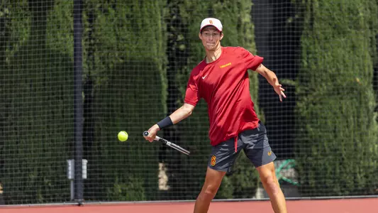 Niels Hoffmann hits a return on the tennis court