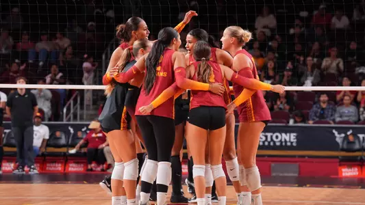 USC women's volleyball players huddle on the court after a point during a match against Purdue at Galen Center
