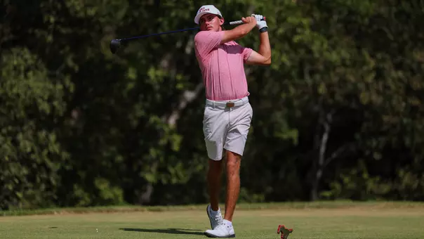 USC Men's Golf's Jack Buchanan hits a tee shot with his driver.