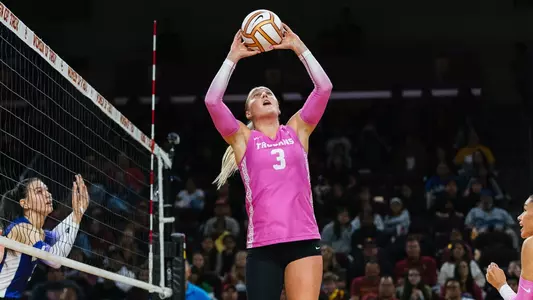 USC women's volleyball freshman setter Reese Messer sets the ball during a match against Washington at Galen Center