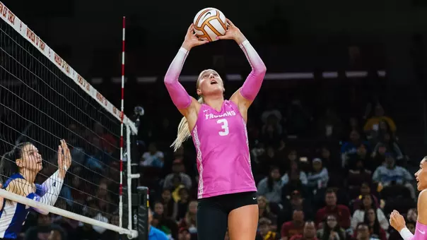 USC women's volleyball freshman setter Reese Messer sets the ball during a match against Washington at Galen Center