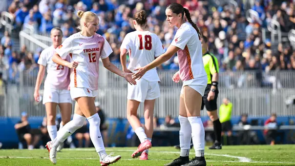 Faith George, Murphy Walsh shake hands during USC's 0-0 draw at UCLA.