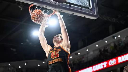 Gabe Dynes dunking on his opponents during an exhibition at Grand Canyon