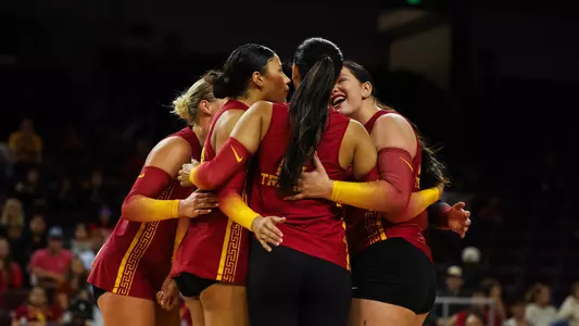 USC women's volleyball huddles at center court during a match against Purdue at Galen Center