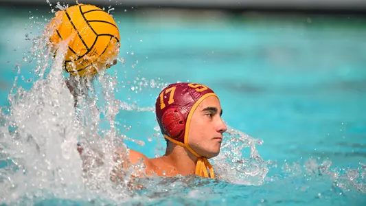 Efe Naipoglu looks to pass the ball.