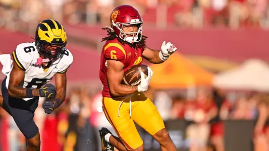 USC WR Makai Lemon turns downfield after catching the ball.