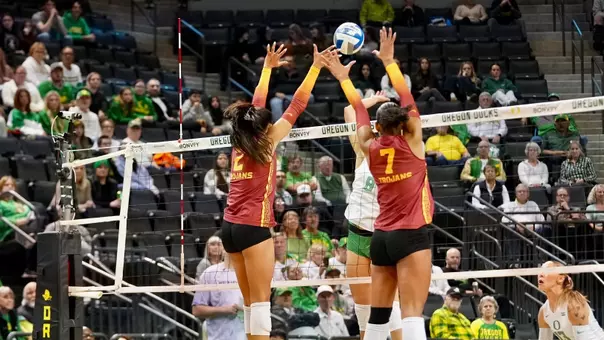 USC women's volleyball outside hitter London Wijay and middle blocker Leah Ford go up to block an Oregon attack at Matthew Knight Arena.