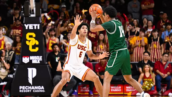 Jacob Cofie playing defense against Cal Poly