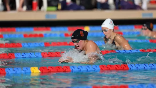 Ashley McMillan swimming breastroke in pool.