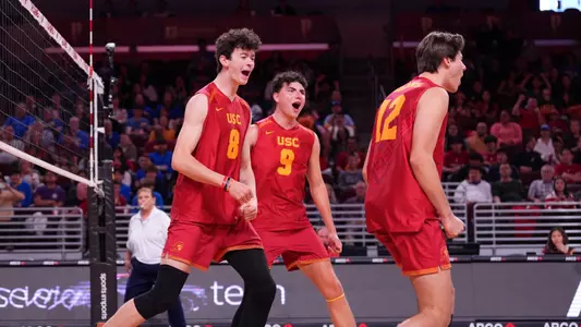 USC men's volleyball setter Caleb Blanchette and middle blocker Parker Tomkinson celebrate a point during a match against crosstown rival UCLA at Galen Center