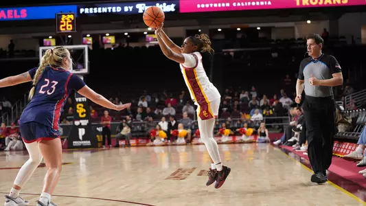 Londynn Jones releases the Ball in a three pointer.