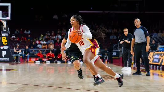 Malia Samuels drives to the basket with the ball