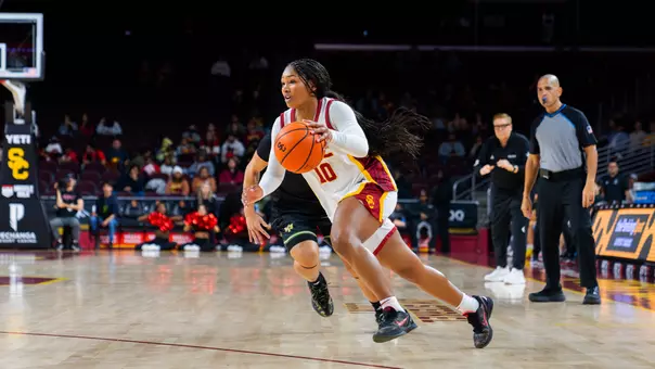 Malia Samuels drives to the basket with the ball