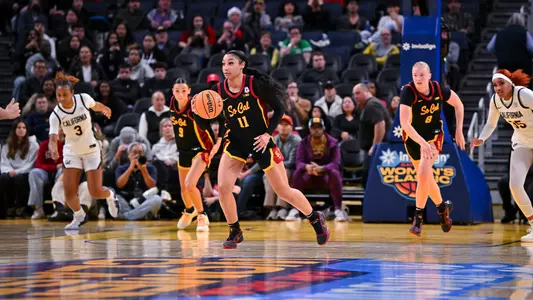 Kennedy Smith brings the ball down the court.