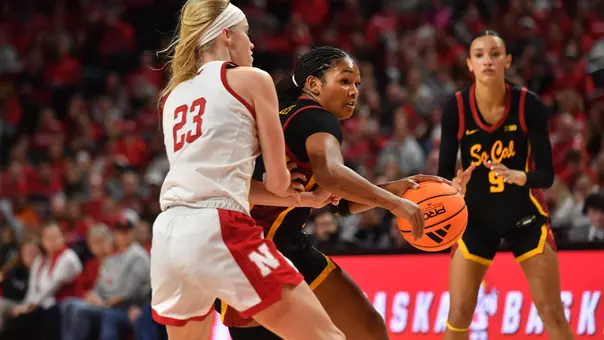 Malia Samuels drives past an opponent on the court