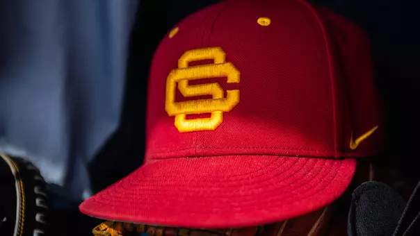Photo of a hat in the dugout of a baseball game.