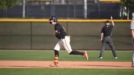 Brayden Dowd celebrates after hitting a go-ahead 3-run home run against George Washington in Game 3 of the series.