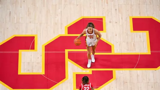 Talia von Oelhoffen brings up the ball across the USC logo at Galen Center