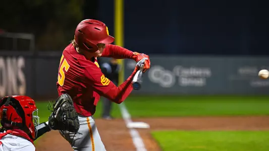 Ethan Hedges hits against LMU at Page Stadium.