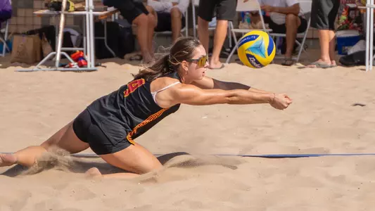 USC beach volleyball junior Mabyn Thomas dives to save a ball at Manhattan Beach.