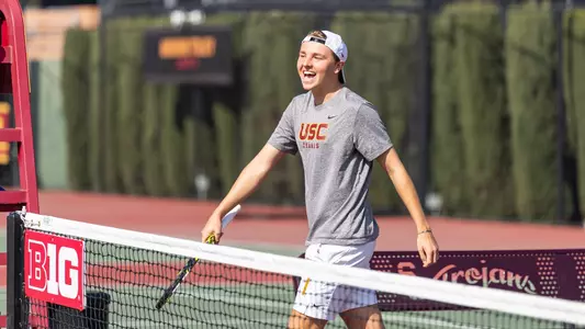 Oscar Weightman Smiling as he walks towards the net in warmups