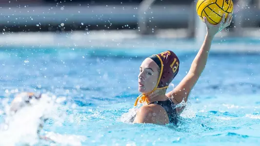 Sofia Umeda surveys the pool with the ball in a game at Uytengsu Aquatics Center