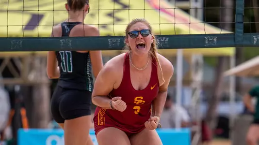 USC beach volleyball freshman Kennedy Coakley cheers after scoring a point at the Outrigger Duke Kahanamoku Beach Classic on Queen's Beach in Honolulu, Hawai'i