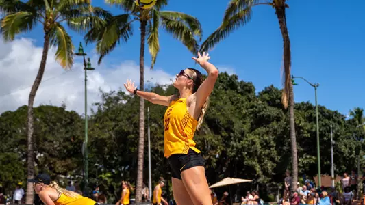 USC beach volleyball graduate Maya Gessner goes up to serve a ball in a dual against Arizona State at the 2025 OUTRIGGER Duke Kahanamoku Beach Classic on Queen's Beach in Honolulu, Hawai'i.