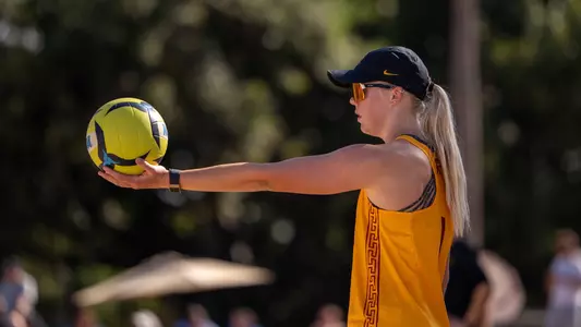 USC beach volleyball sophomore Ashley Pater gets ready to serve the ball in a match against Arizona State in the Outrigger Duke Kahanamoku Beach Classic in Honolulu, Hawai'i.