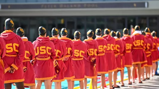 USC players line up for the national anthem before a game at Uytengsu Aquatics Center.