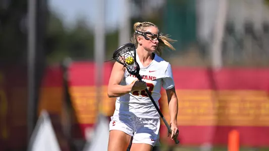 Close Up shot of USC lacrosse's Reese Robinson as she runs down the field against Arizona State