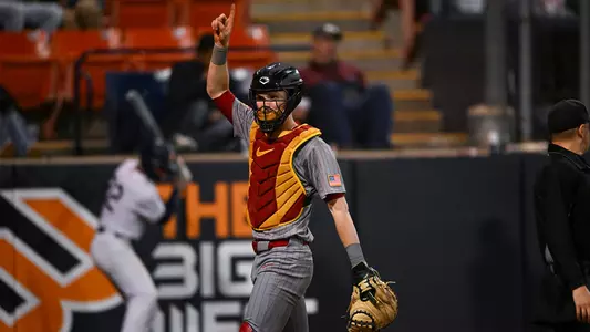 Catcher John Elliott raises one finger to signal an out during a game at Cal State Fullerton.