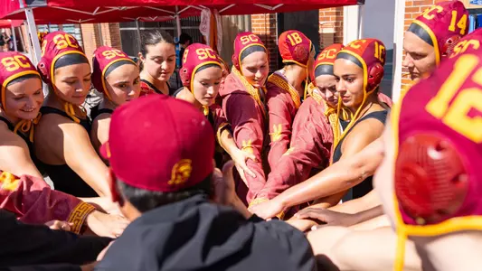 USC players huddle up for a cheer before playing Indiana at Uytengsu Aquatics Center