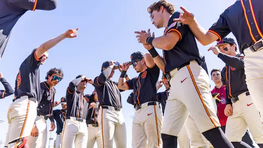 The USC baseball team gets ready to huddle pregame against No. 10 Oregon.