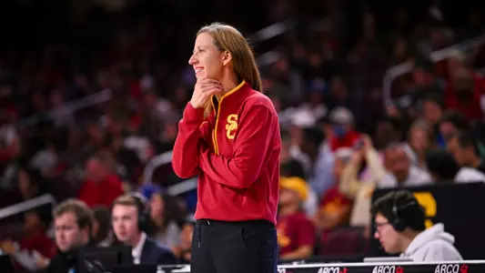 Lindsay Gottlieb smiles on the sideline during a game at Galen Center