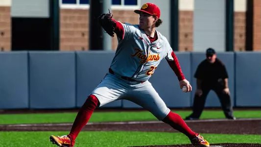 Left-handed pitcher Caden Hunter is captured mid-pitch against Michigan.