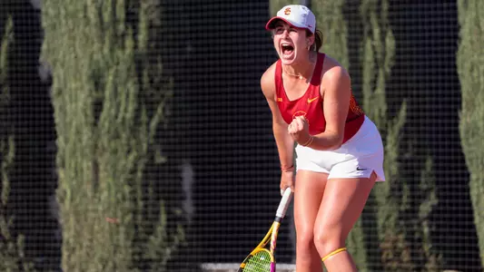 Emma Charney celebrates after clinching USC's match against Oregon.