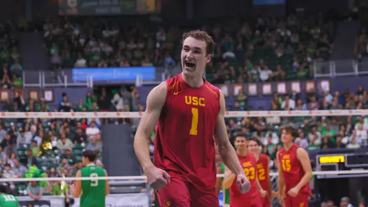 USC men's volleyball junior outside hitter celebrates a win against third-ranked Hawai'i in the Outrigger Invitational at SimpliFi Arena at Stan Sheriff Center in Honolulu, Hawai'i.