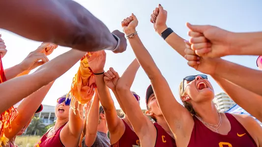 USC beach volleyball shouts in a team huddle at the FAU Beach Invitational in Pompano Beach, Fla.