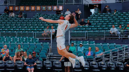 USC men's volleyball junior OH Dillon Klein serves the ball in a match against Penn State in the Outrigger Invitational at Stan Sheriff Center in Honolulu, Hawai'i