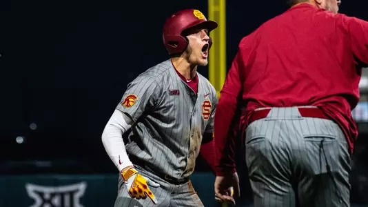 USC first baseman, Dean Carpentier, celebrates after hitting a triple against Arizona State.