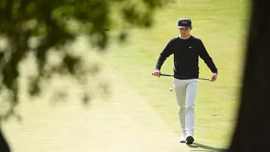 USC Sophomore Jack Jerge walks up to examine is line on the green at the Southwestern Invitational