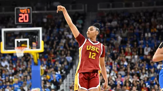 JuJu Watkins holds her hand in the air after a 3-pointer at UCLA.