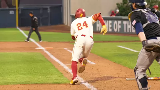 Augie Lopez runs to first after a hit in the Trojans game against UC Irvine on Tuesday.