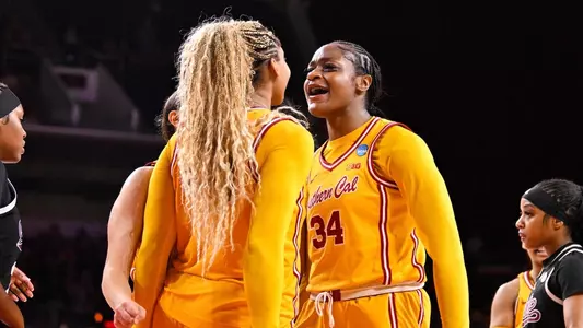 Clarice Akunwafo and Kiki Iriafen celebrate a play during USC's NCAA Second Round win over Mississippi State