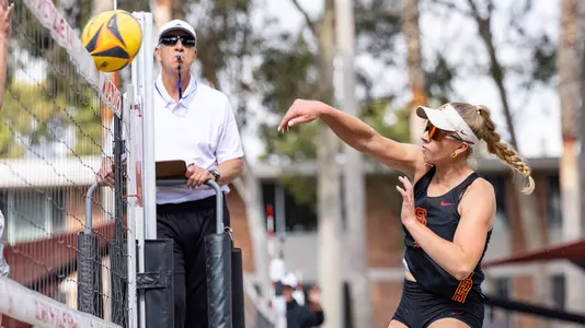 USC beach volleyball freshman Calinda Kok attacks the ball during a match at Merle Norman Stadium