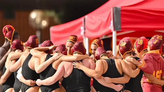 USC players huddle up before a game at Uytengsu Aquatics Center.