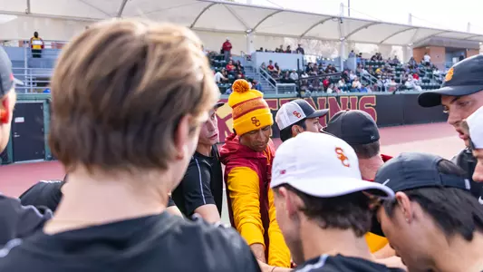 The Men's Tennis team huddles ahead of their match against UCLA